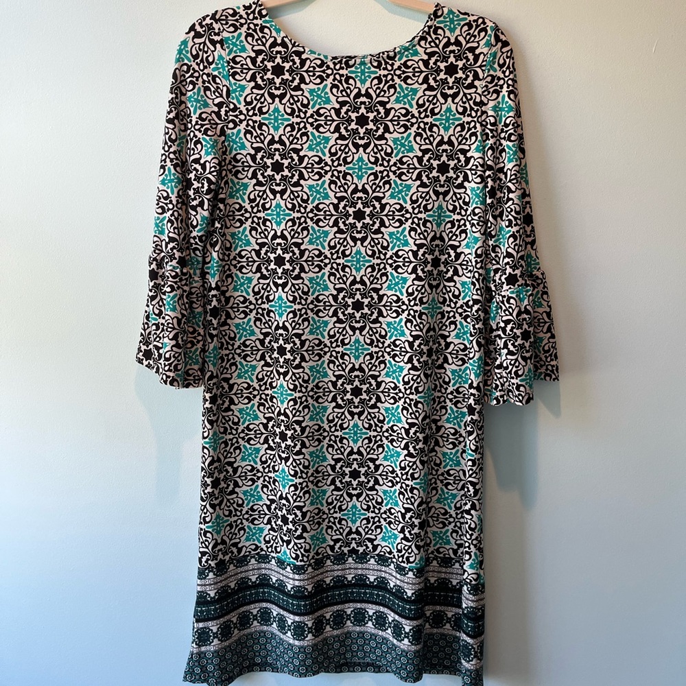 Kim Rogers turquoise and black dress